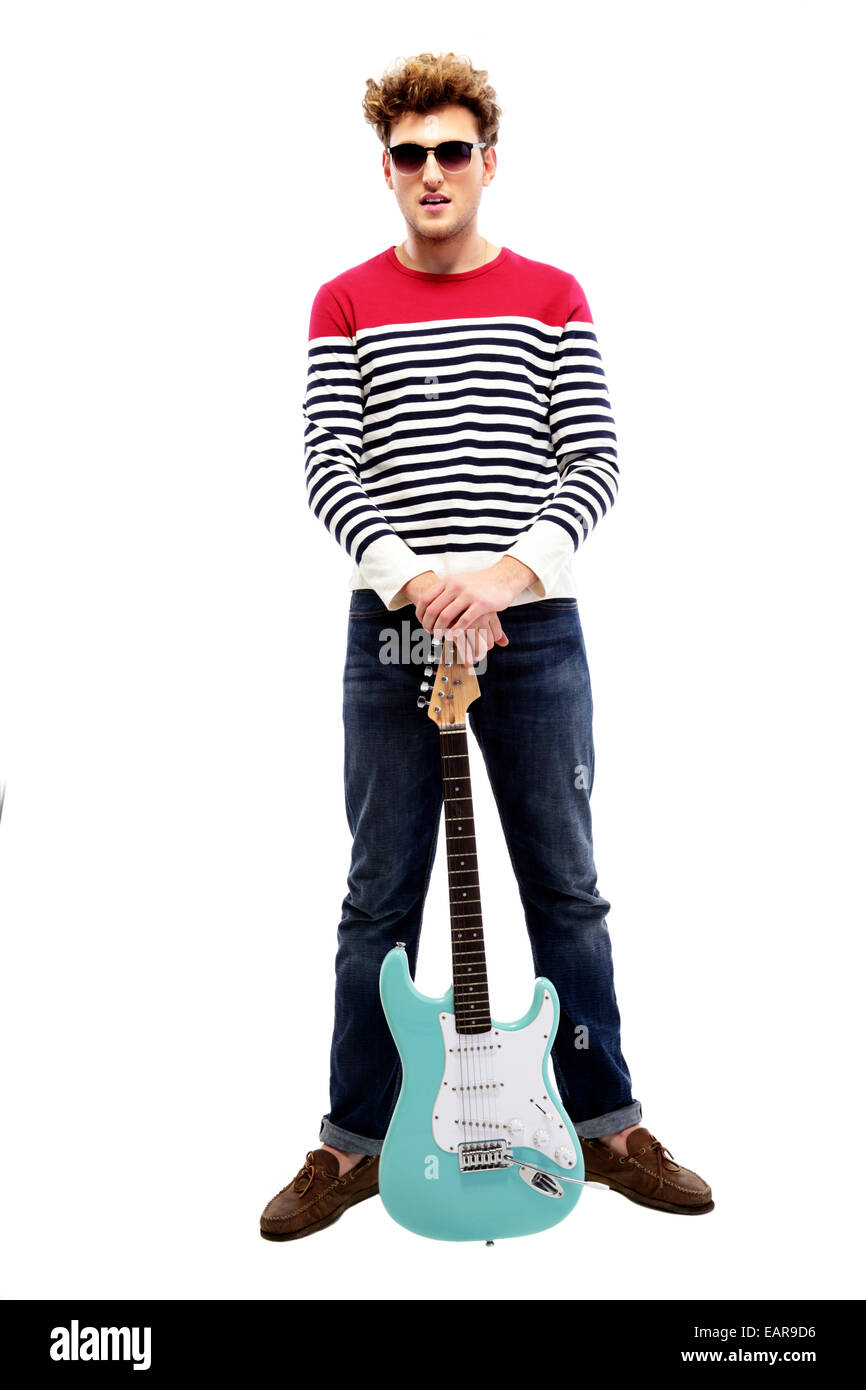 Full length portrait of a fashion man standing with guitar Stock Photo