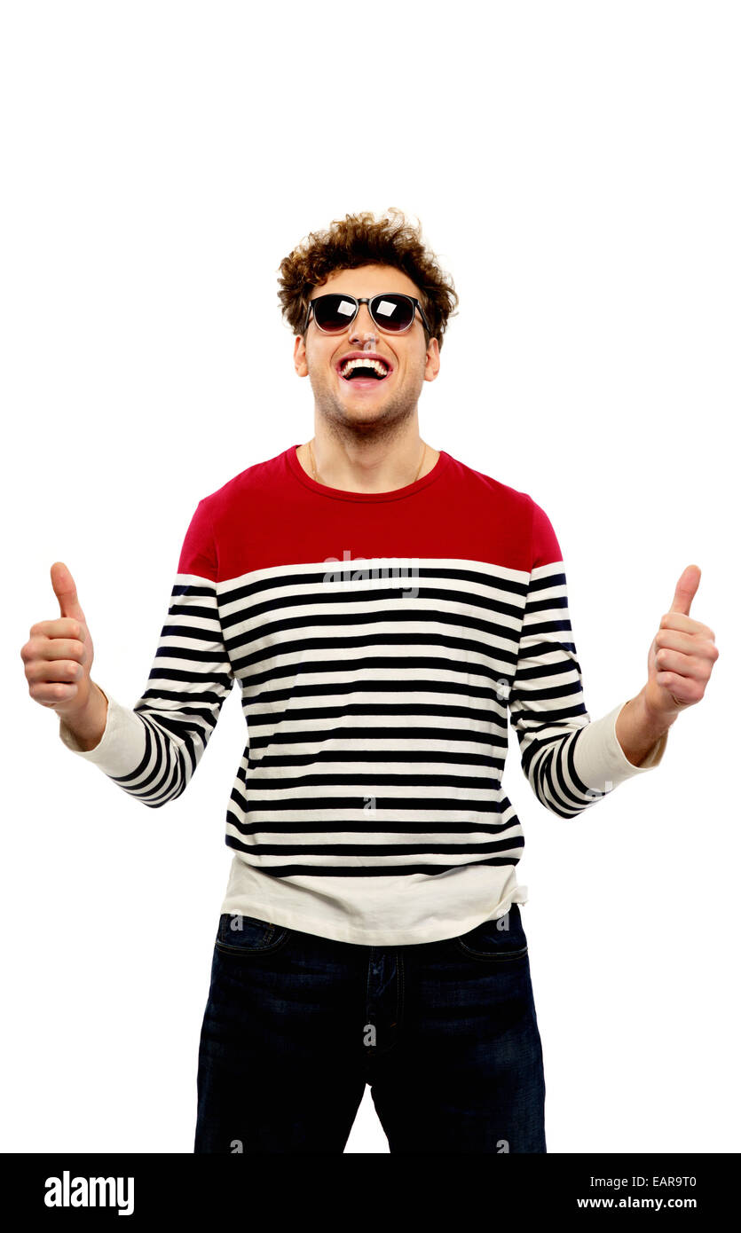 Fashion man in sunglasses with thumbs up over white background Stock Photo