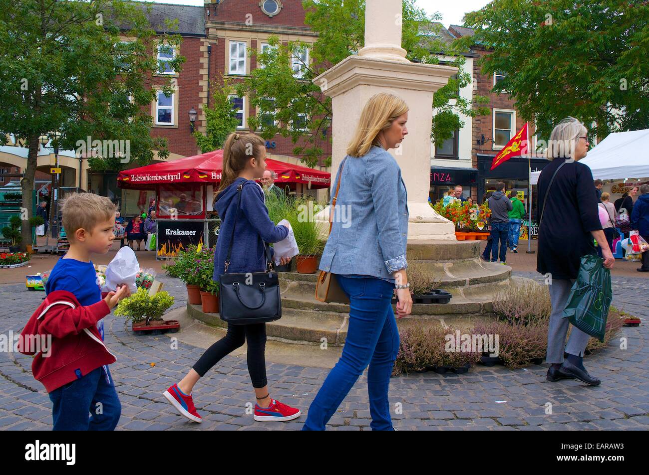 Family walking through Carlisle Continental Market. Carlisle Town Centre, Carlisle, Cumbria, England, UK. Stock Photo