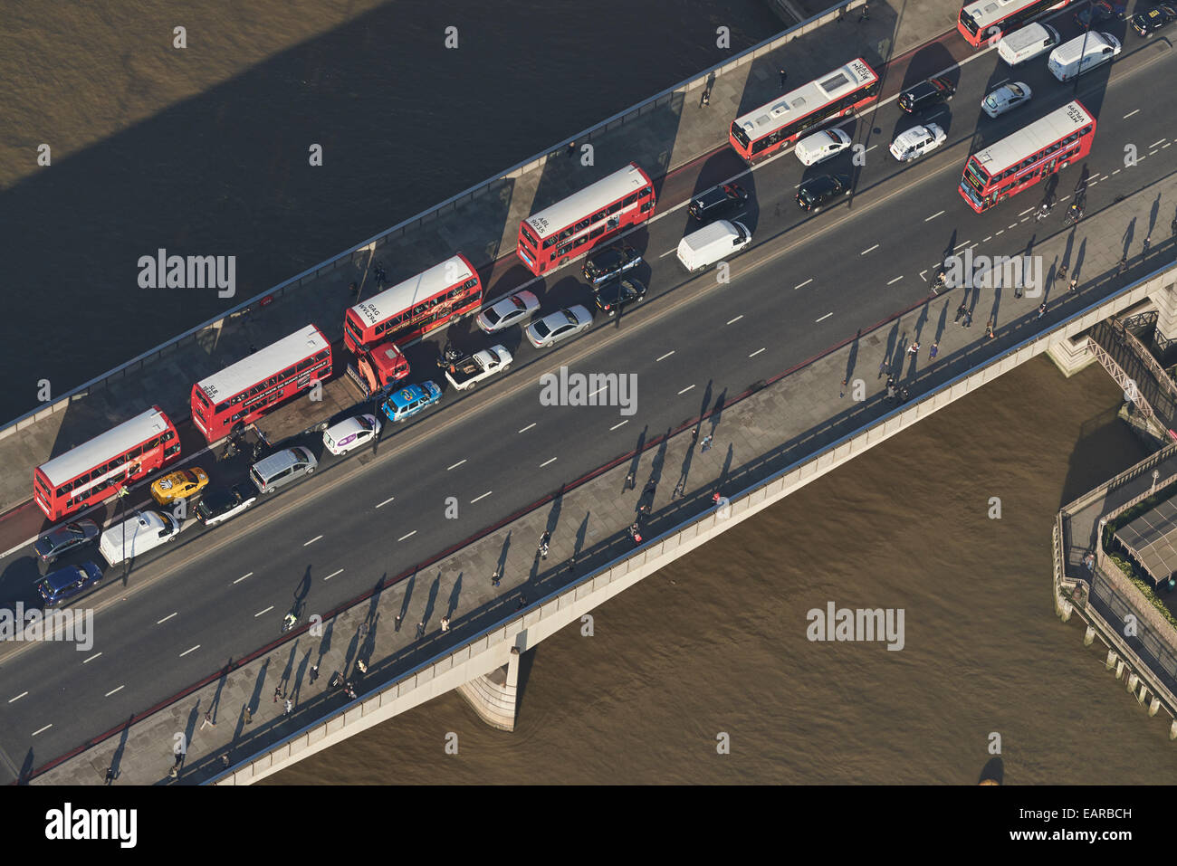 A close up aerial view of traffic crossing London Bridge into the City of London during morning rush hour Stock Photo