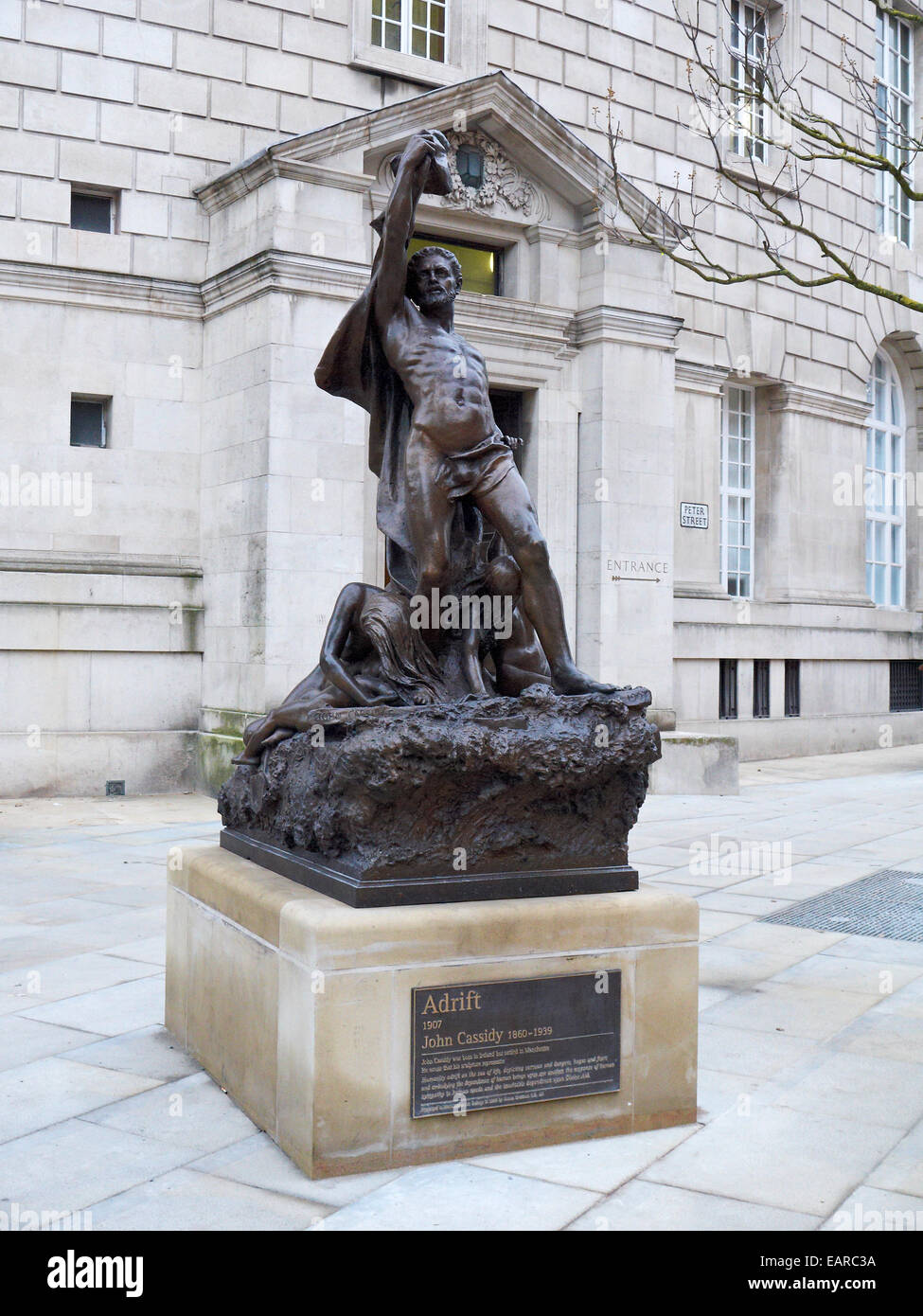Adrift statue by John Cassidy in Peter Street Manchester UK Stock Photo