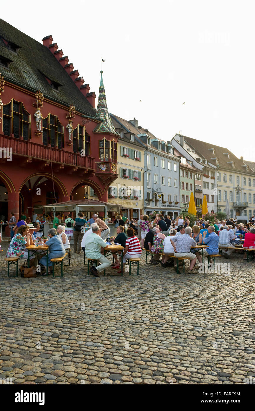Wine stand and restaurants in front of the Historical Merchants Hall on Muensterplatz square or Cathedral Square Stock Photo