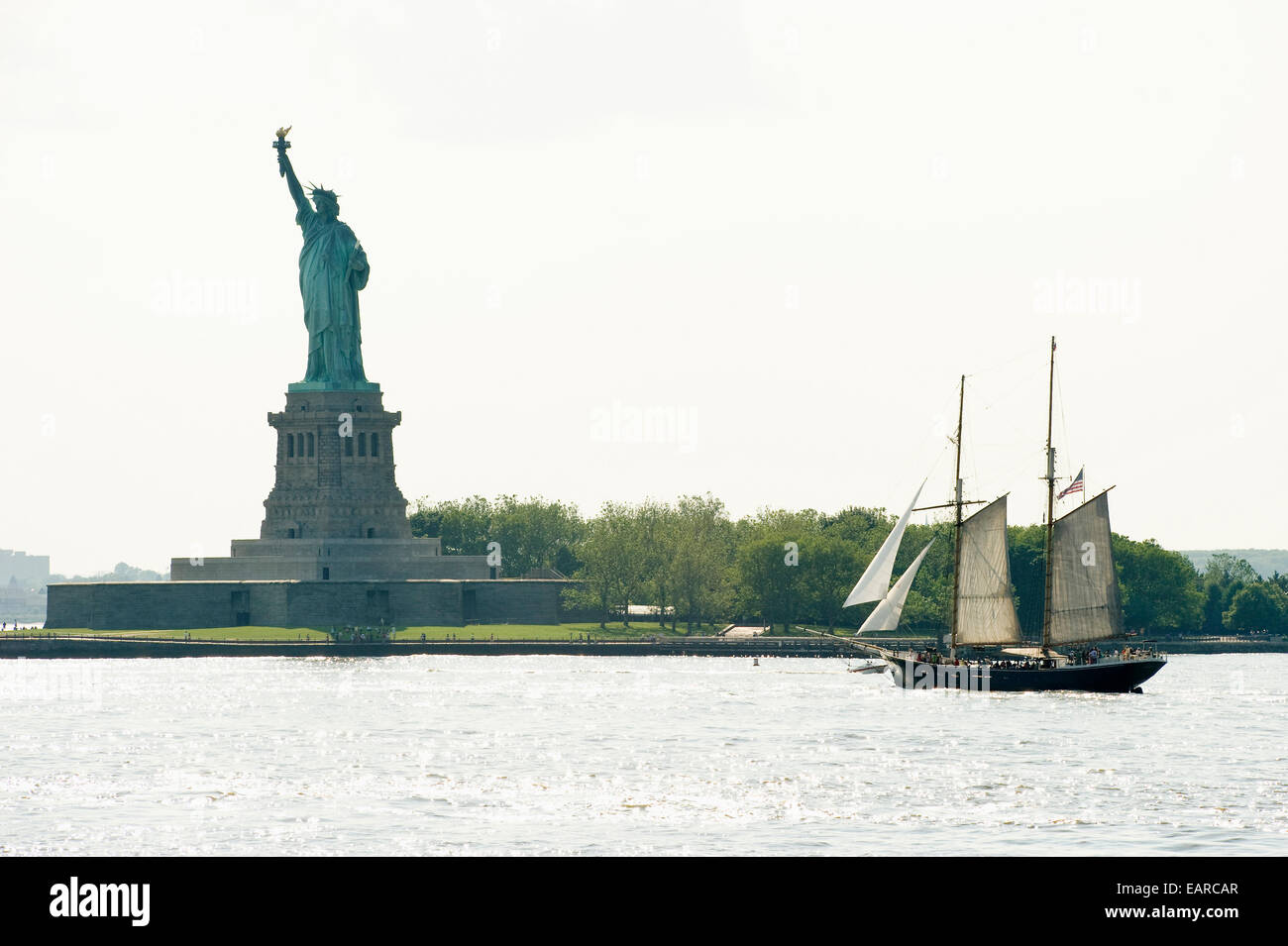 Historic sailing ship and the Statue of Liberty, Manhattan, New York City, New York, United States Stock Photo