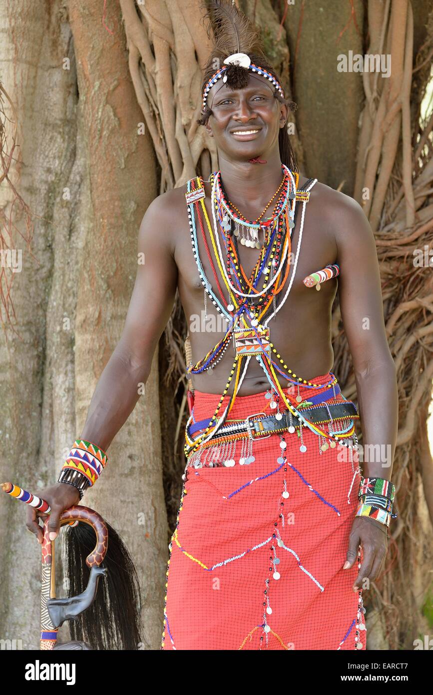 Maasai warrior wearing traditional dress, near Enkutoto, Masai Mara, Rift  Valley Province, Kenya Stock Photo - Alamy