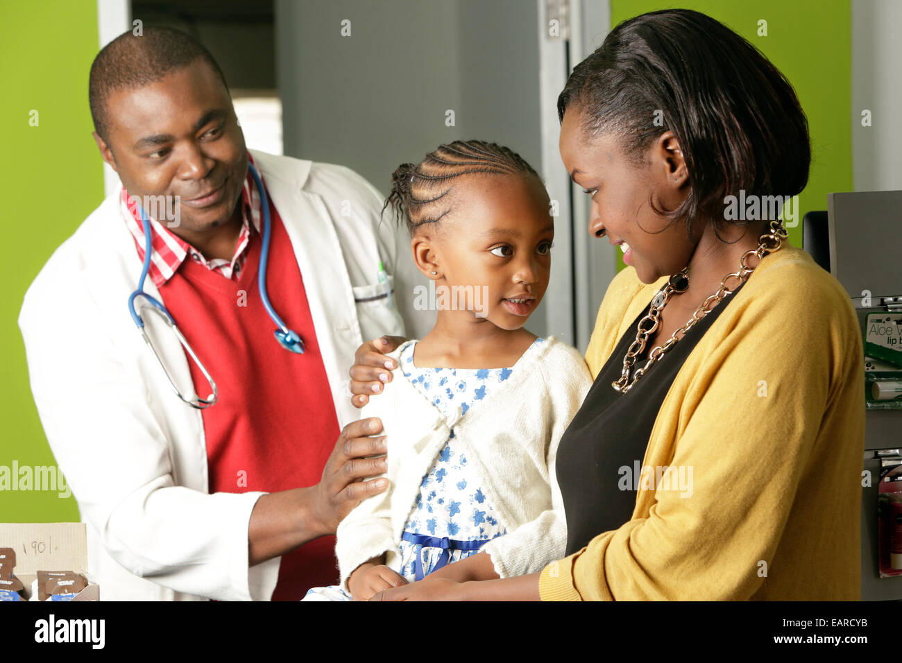 Daughter examined at pharmacy with mother Stock Photo