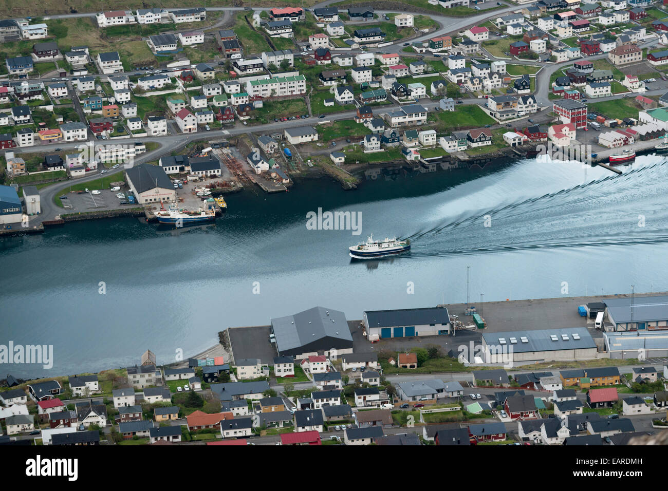 Departing ferry, port and houses, Klaksvik, Borðoy, Norðoyar, Faroe Islands, Denmark Stock Photo
