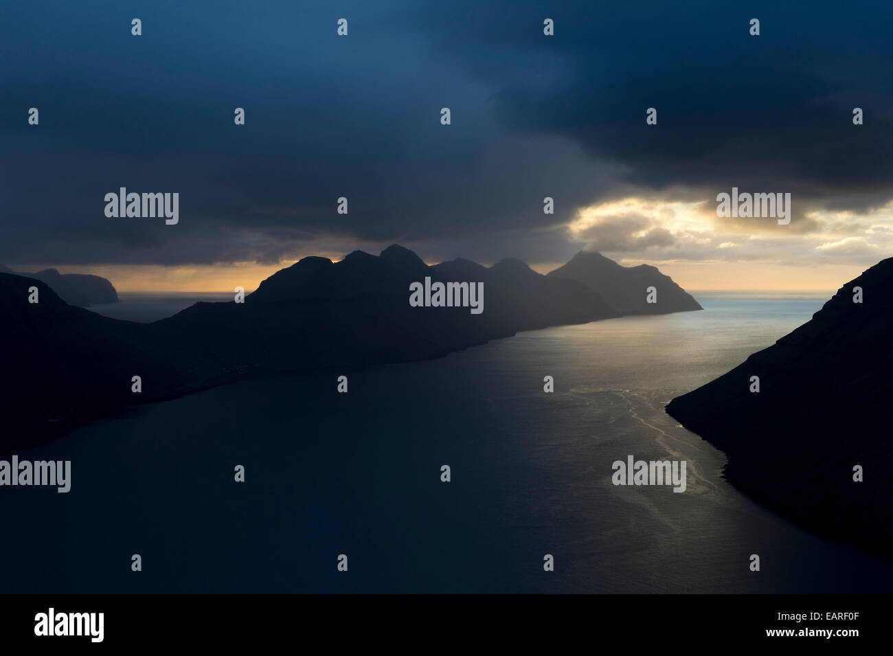 Dramatic mood lighting over the islands of Kalsoy and Kunoy, Kalsoy, Norðoyar, Faroe Islands, Denmark Stock Photo