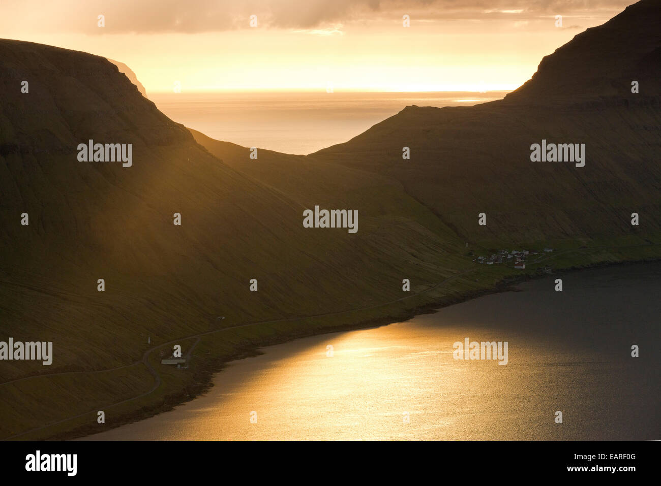 Dramatic mood lighting over the island of Kalsoy, Husar, Kalsoy, Norðoyar, Faroe Islands, Denmark Stock Photo