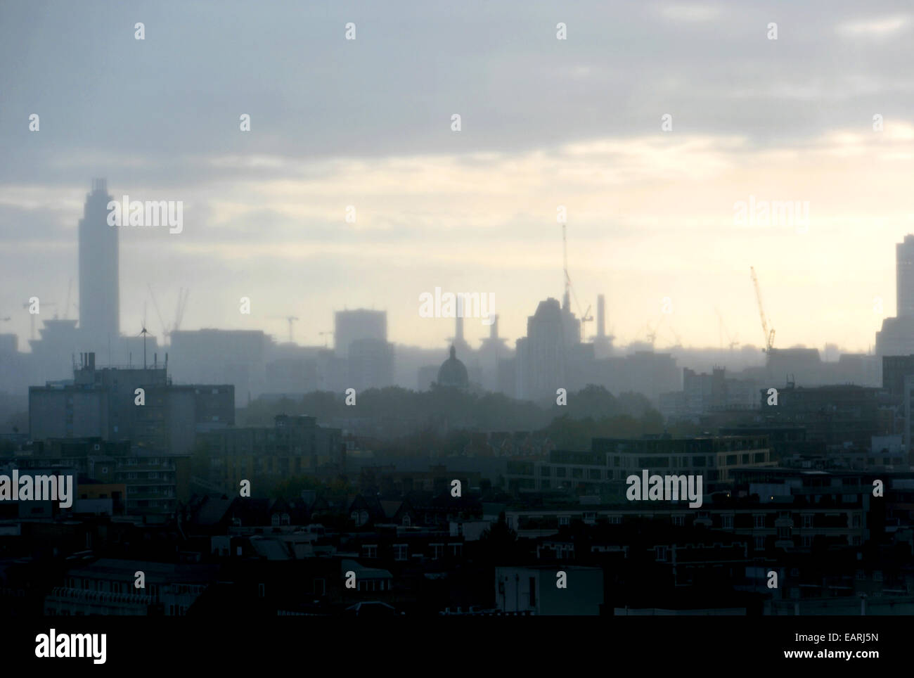 Rain on the horizon. A distant storm darkens the London sky as dusk begins to fall Stock Photo