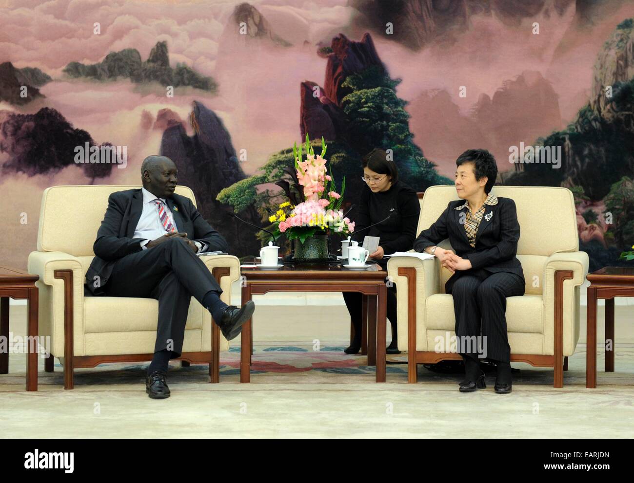(141120) -- BEIJING, Nov. 20, 2014 (Xinhua) -- Yan Junqi (R), vice chairwoman of the Standing Committee of China's National People's Congress, meets with political bureau member of Sudan People's Liberation Movement (SPLM) Daniel Awet Akot, who is leading an SPLM senior official training program, in Beijing, China, Nov. 20, 2014. (Xinhua/Zhang Duo) (hdt) Stock Photo