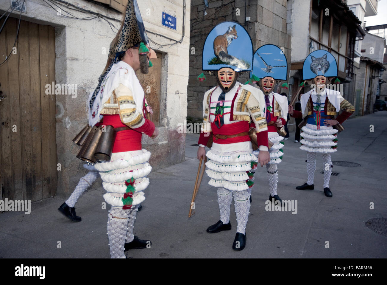 Several 'Cigarrons' typical characters of the Galician carnival march through the city during Carnival Saturday. Stock Photo