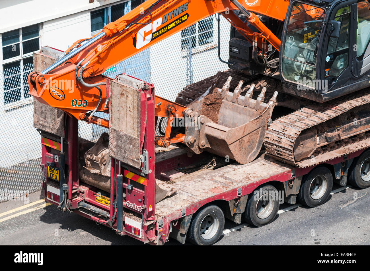 Excavator on a low loader trailer Stock Photo Alamy
