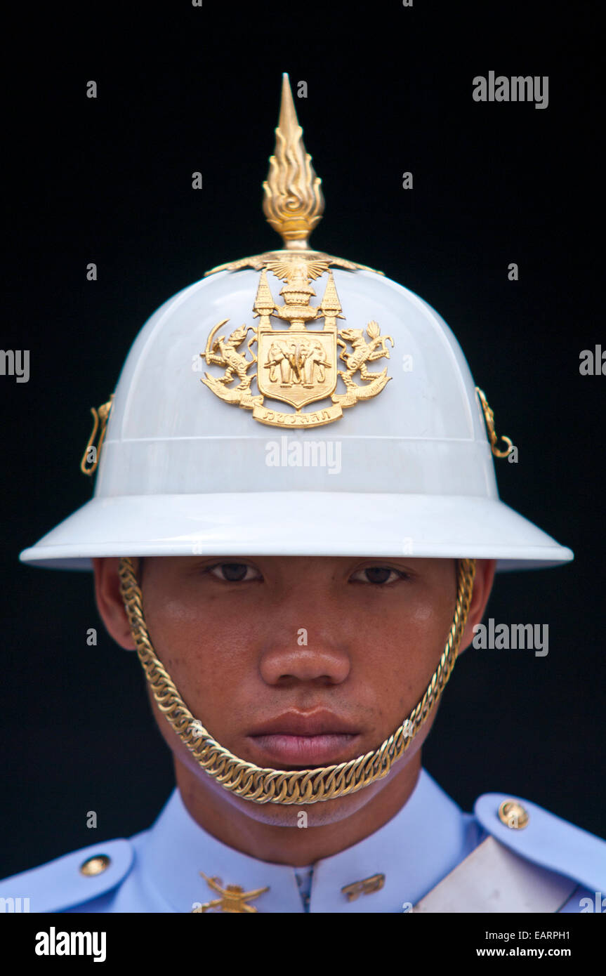 A soldier of the Kings Guard with a white helmet and gold chin-strap. Stock Photo