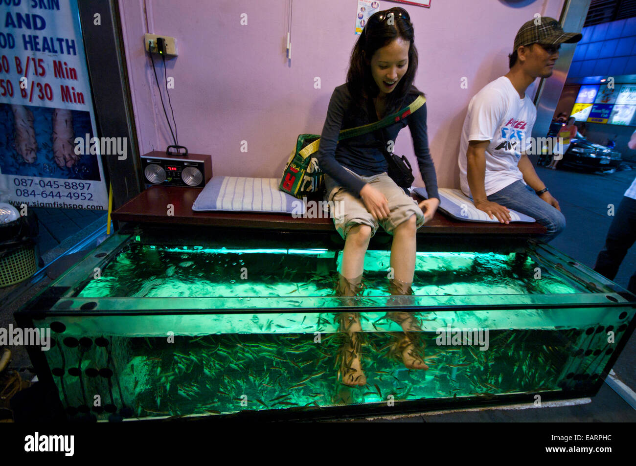 Flesh eating fish devour dead skin cells from a fish spa patrons feet
