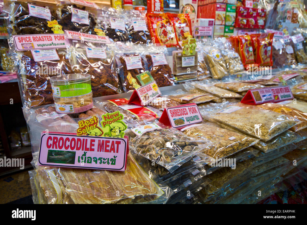 Crocodile meat and dried goods for sale in a shopping mall food court. Stock Photo