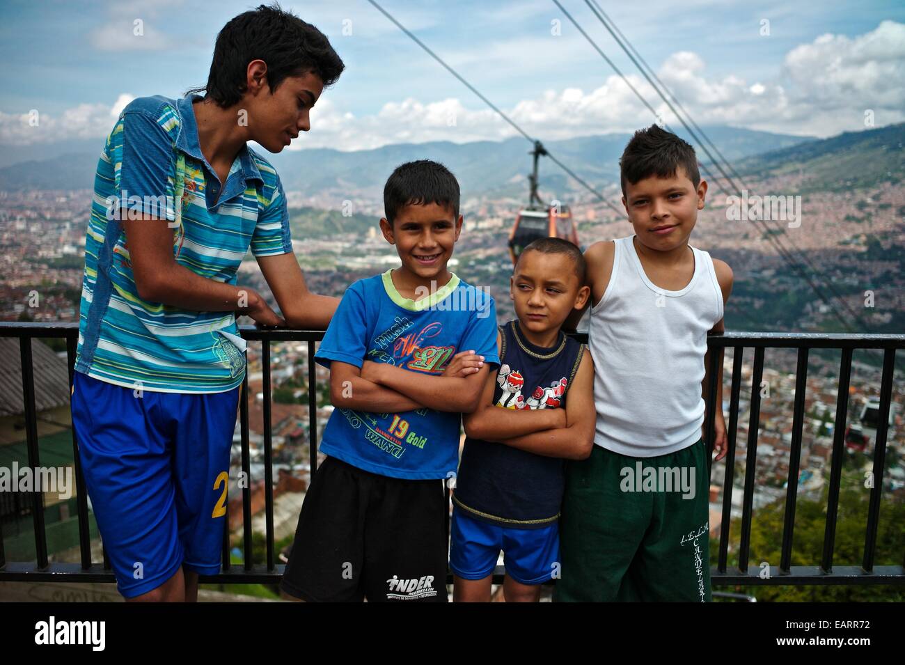 Children in front of the Espana Library, and The Medellin Metrocable. Stock Photo
