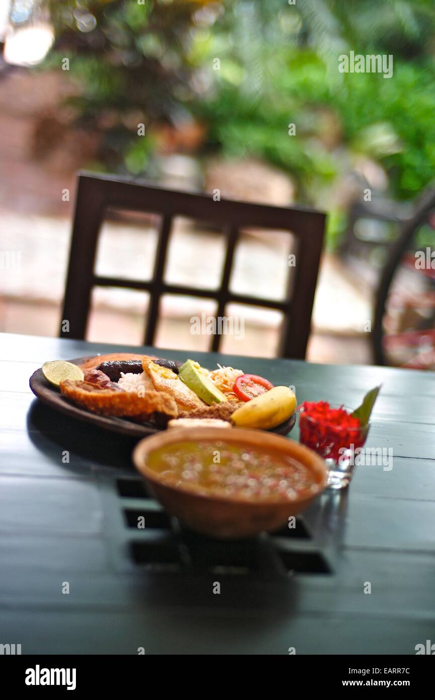Typical bandeja paisana dish that combines a variety of foods. Stock Photo