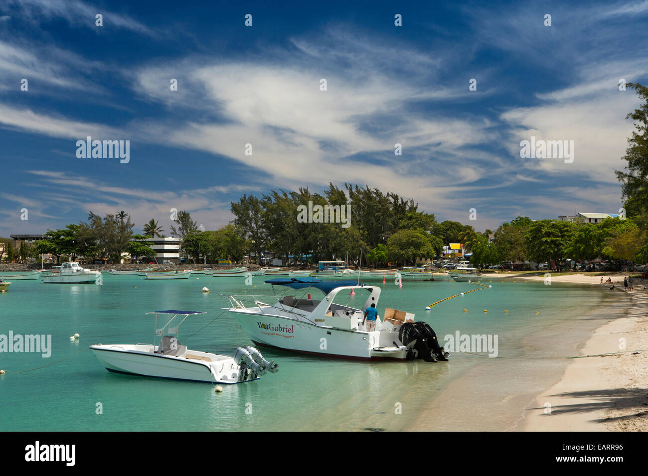 Mauritius, Grand Baie, public beach, leisure boats in shallows Stock ...