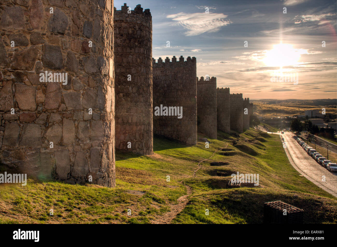 Wall with grass and sunset background Stock Photo - Alamy