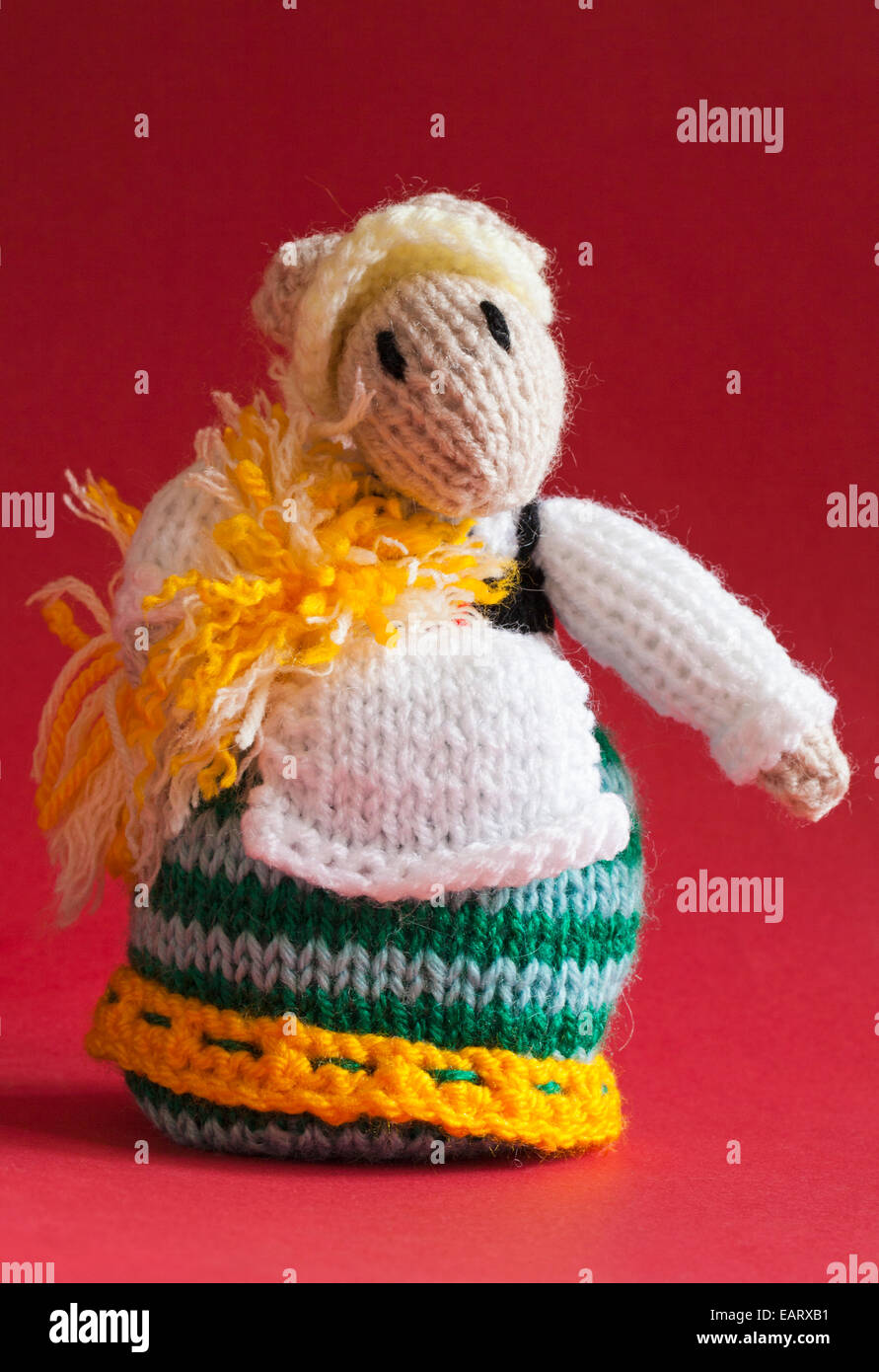 knitted dressed mouse isolated on red background - knitted toy animal ...