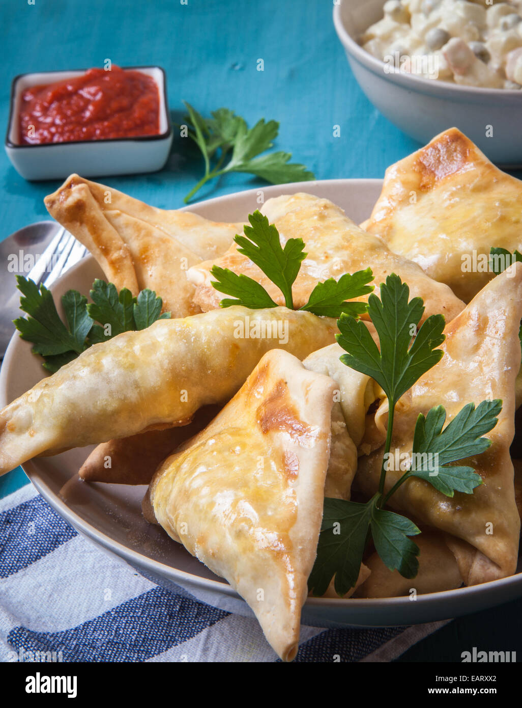 indian samosa filled with chicken curry on tray Stock Photo