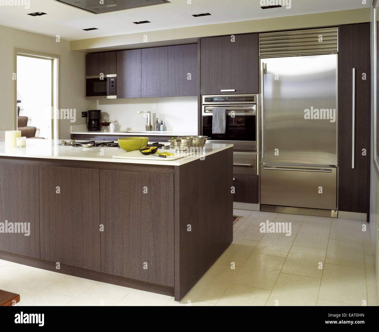 Peninsula unit in spacious kitchen with wood units Stock Photo Alamy