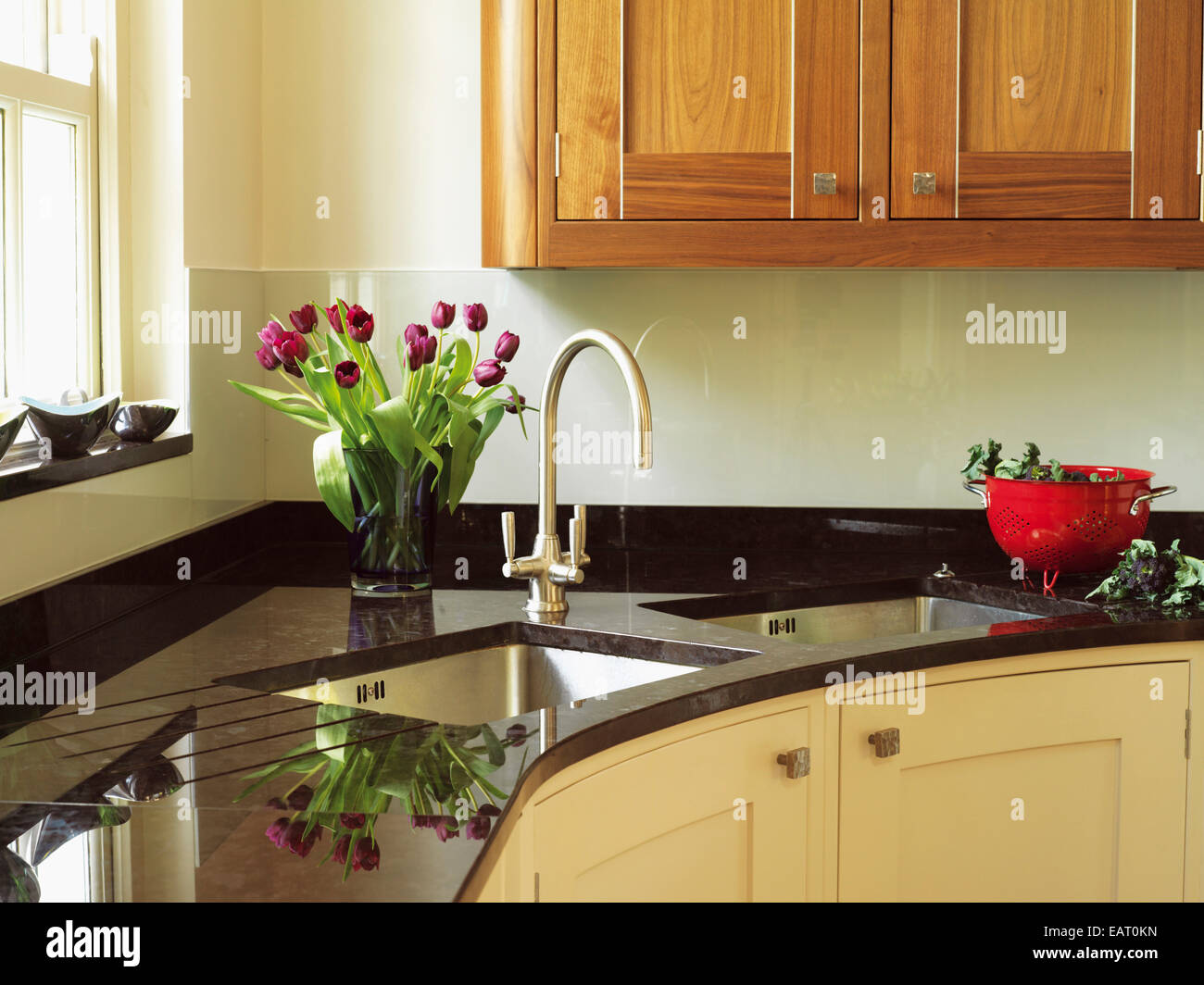 Double sink with tap fitting set in granite worktop in kitchen unit