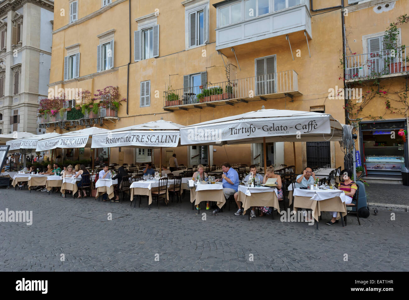 People Dining Alfresco In Piazza Navona In The City Of Rome Italy