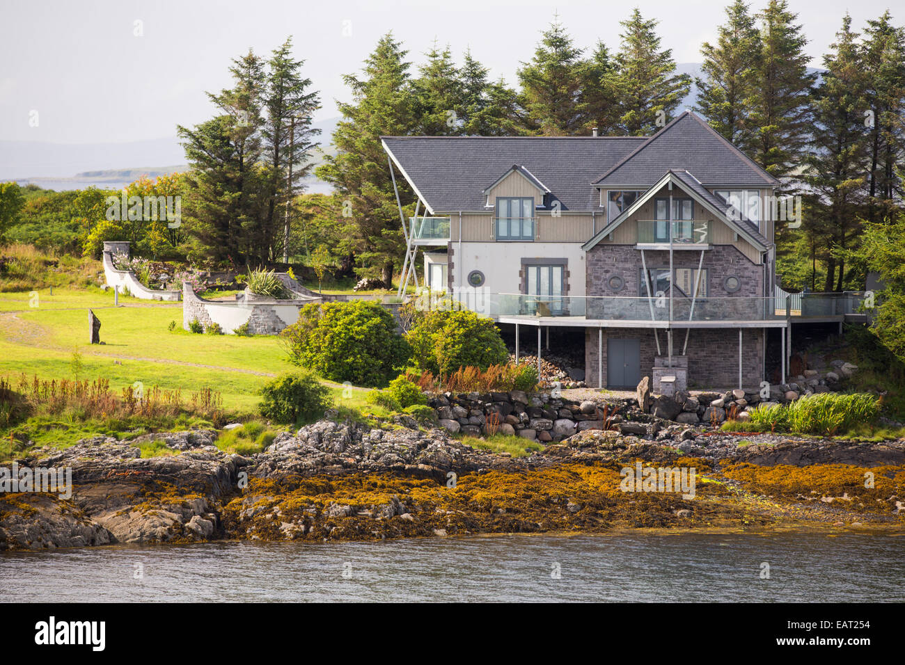 A sea front property on the island of Kerrera, looking towards, Oban, Scotland, UK. Stock Photo