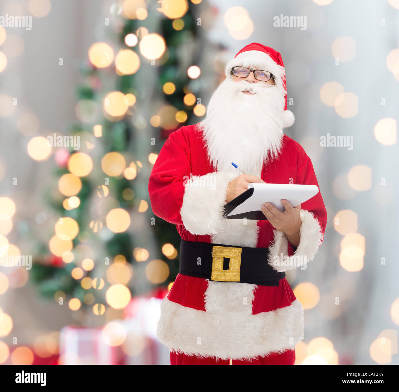 man in costume of santa claus with notepad Stock Photo - Alamy