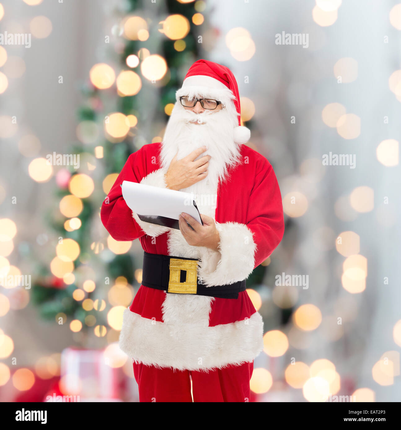 man in costume of santa claus with notepad Stock Photo - Alamy