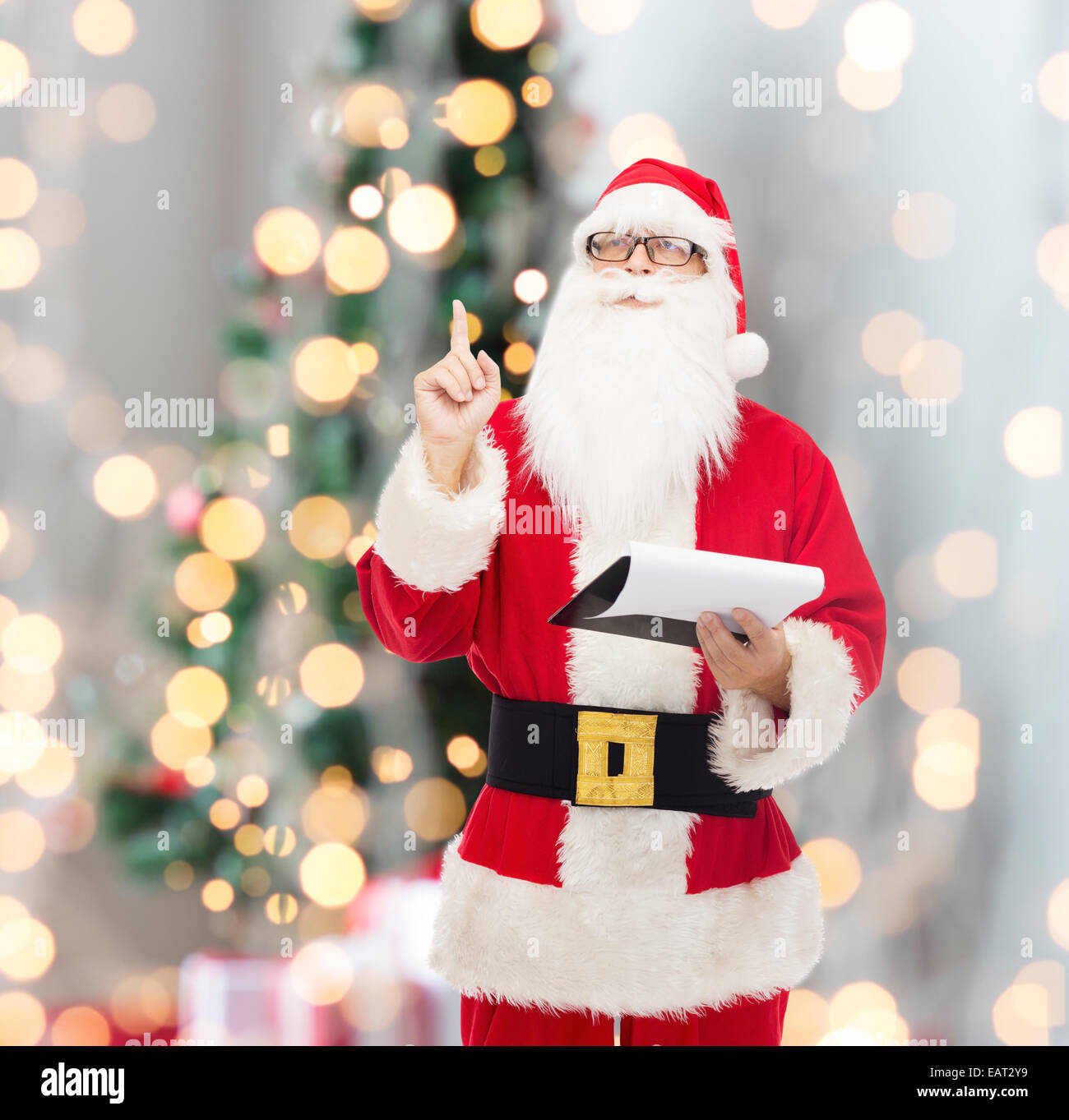 man in costume of santa claus with notepad Stock Photo - Alamy