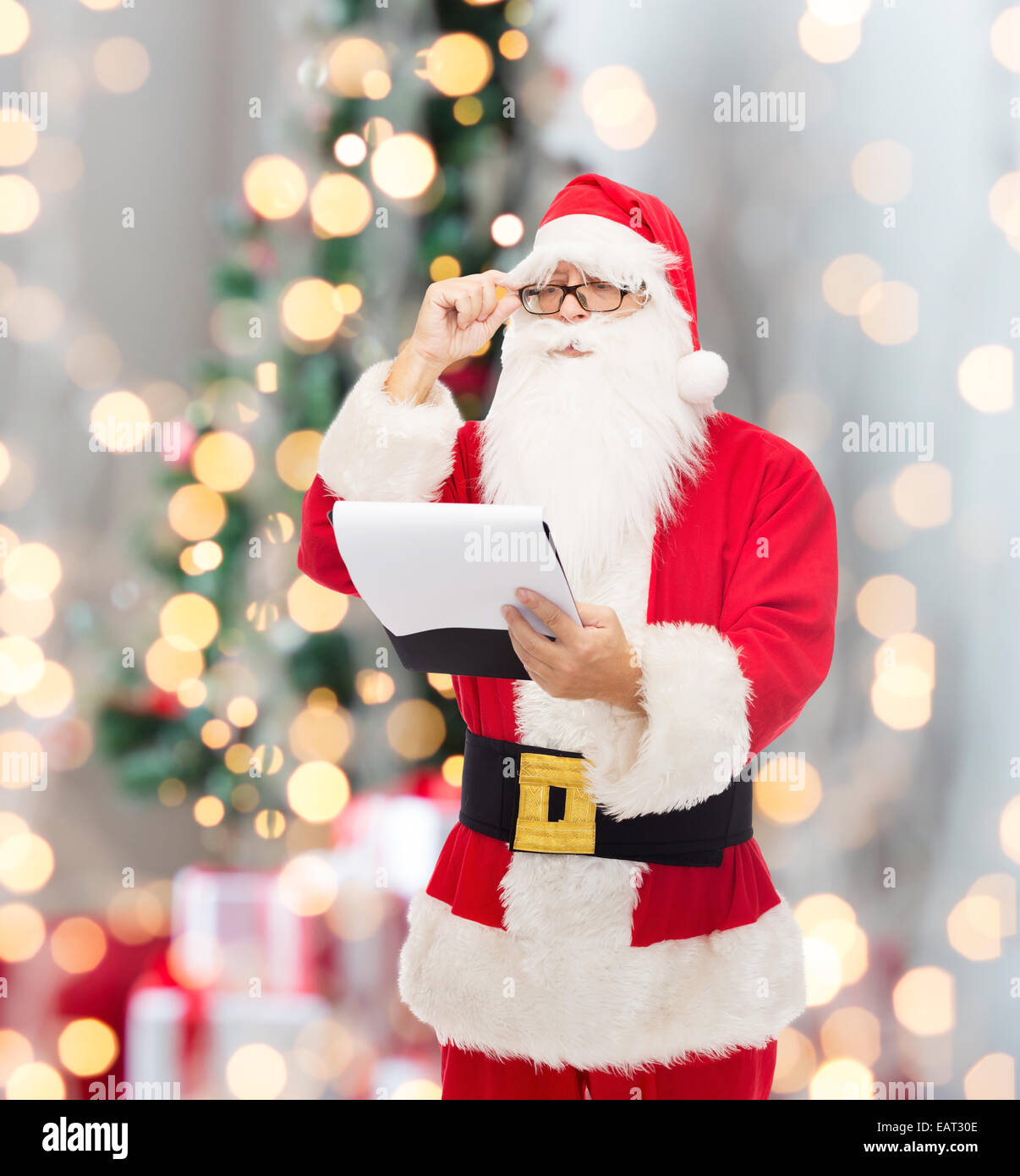man in costume of santa claus with notepad Stock Photo - Alamy