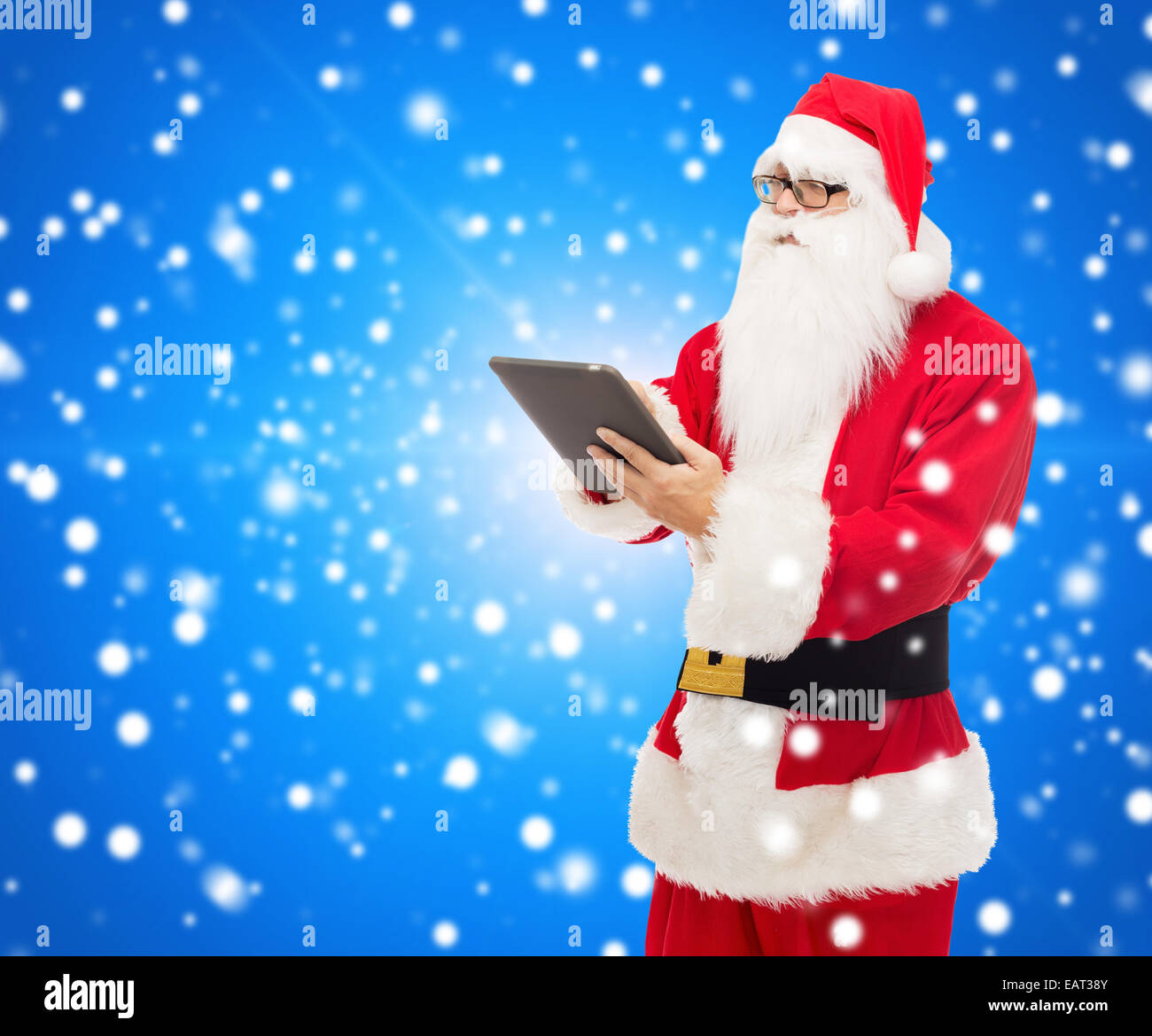 man in costume of santa claus with tablet pc Stock Photo - Alamy