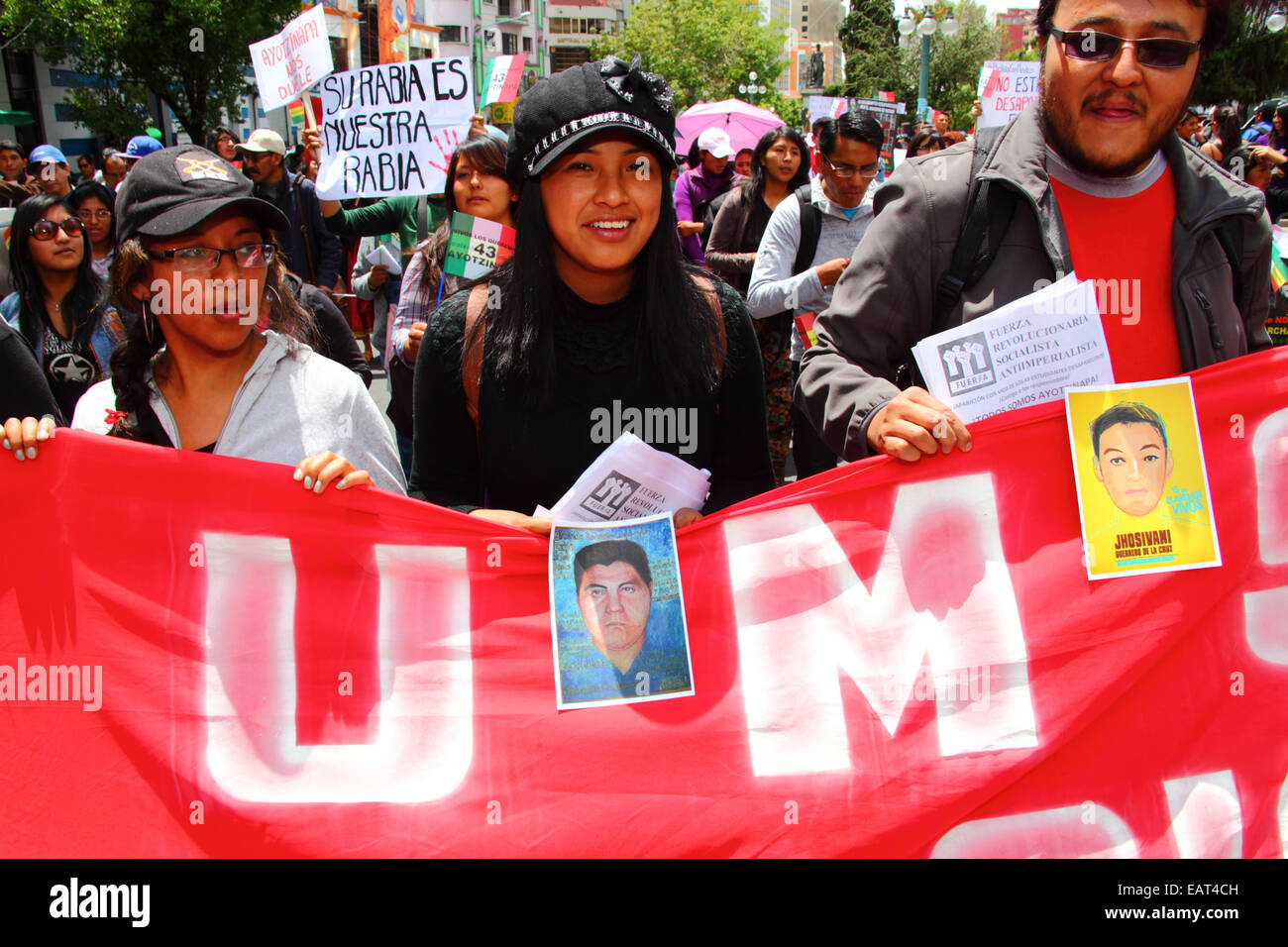 La Paz, Bolivia. 20th November, 2014. Protesters march to demand justice for the 43 missing students in Mexico and protest against the Mexican government's handling of the case and corruption. Today has been designated a Global Day of Action for Ayotzinapa; a national strike is planned in Mexico and many protests are taking place worldwide to show support. The students (who were from a teacher training college) disappeared after clashing with police on the night of 26th September in the town of Iguala. Credit:  James Brunker / Alamy Live News Stock Photo