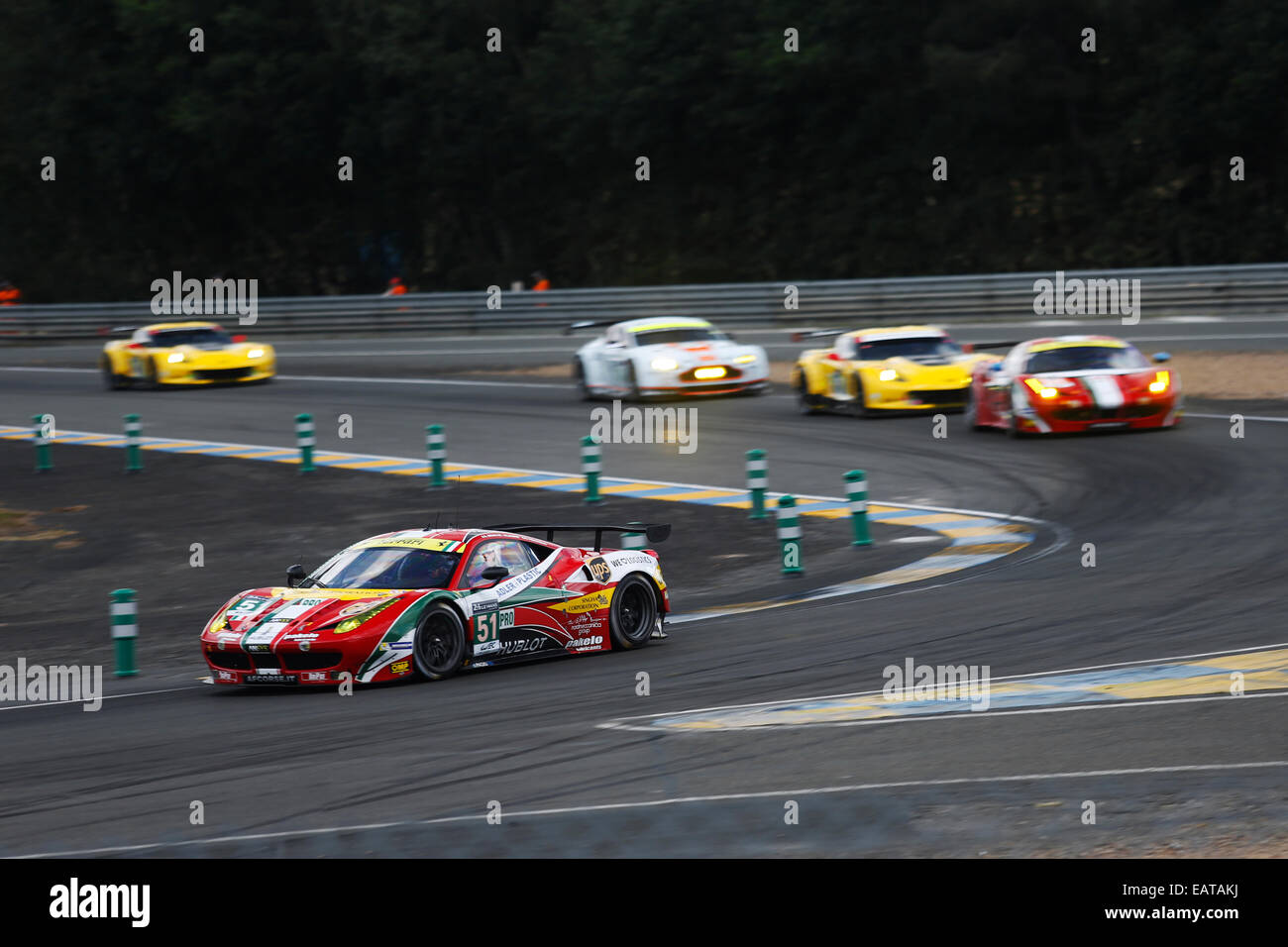 Ferrari 458 Italia pulling away from competition at Le Mans 24H race in Mulsanne corner Stock Photo