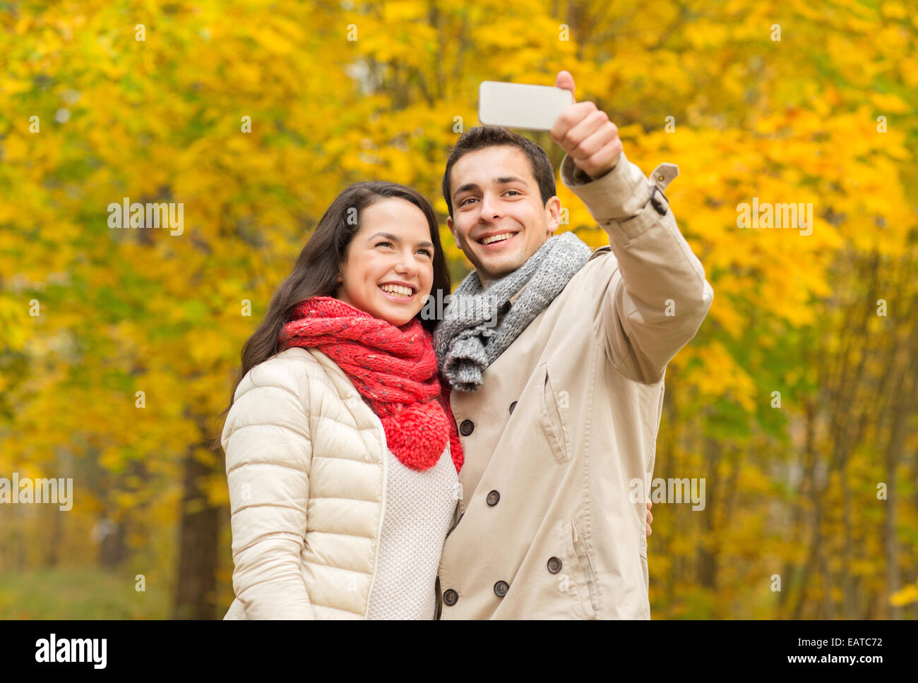 smiling couple hugging in autumn park Stock Photo - Alamy