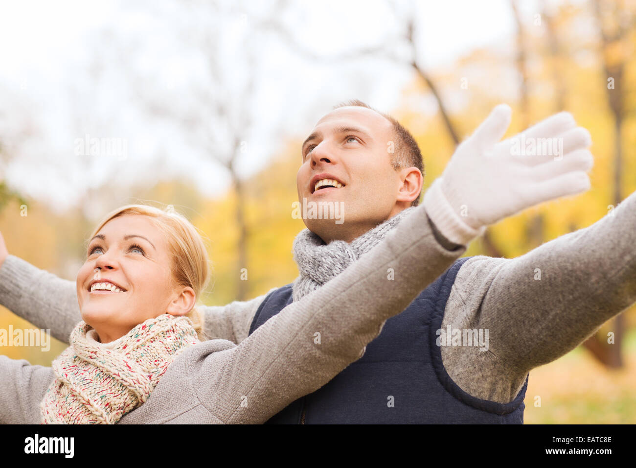 smiling couple in autumn park Stock Photo - Alamy