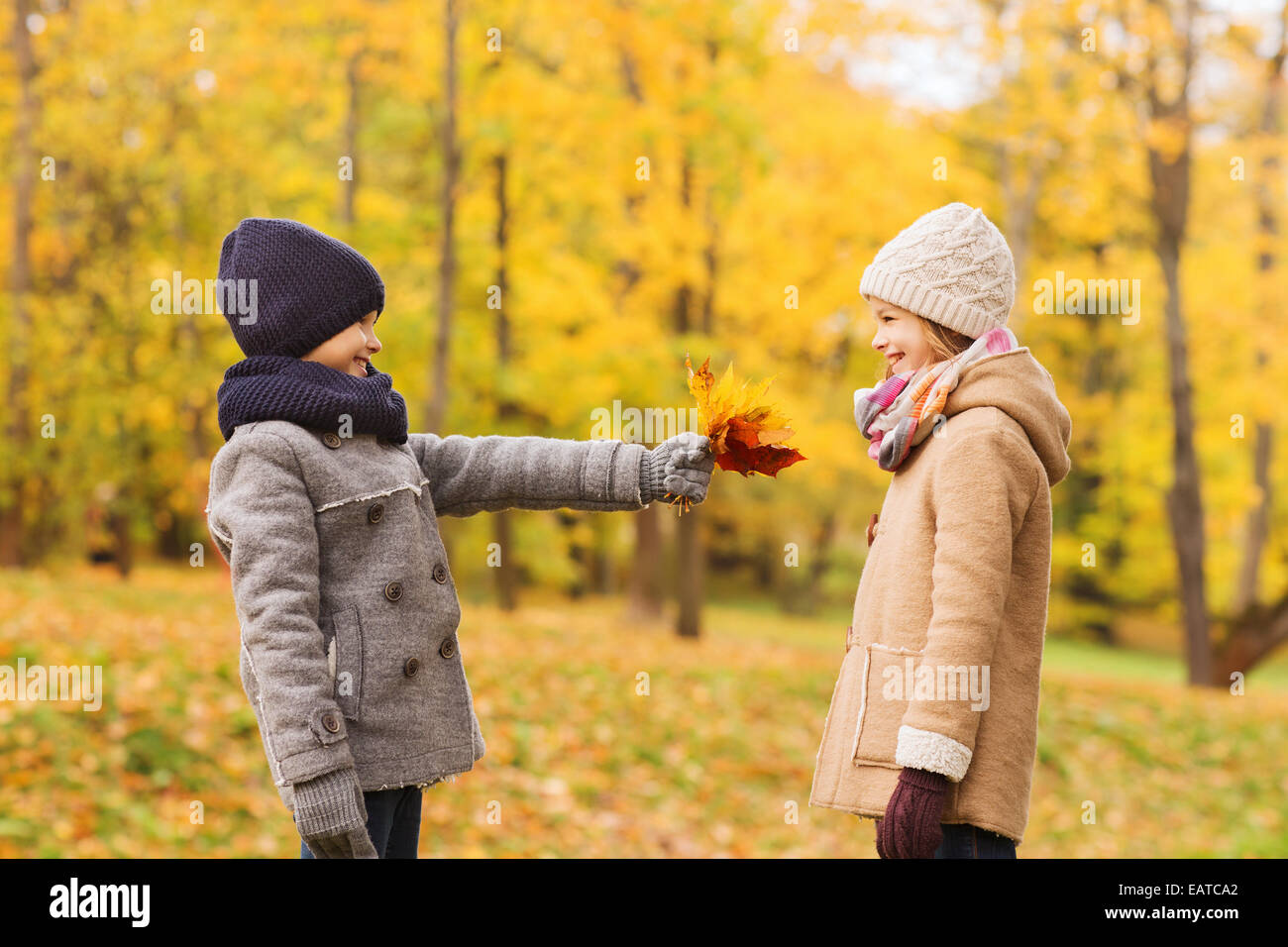 smiling children in autumn park Stock Photo - Alamy
