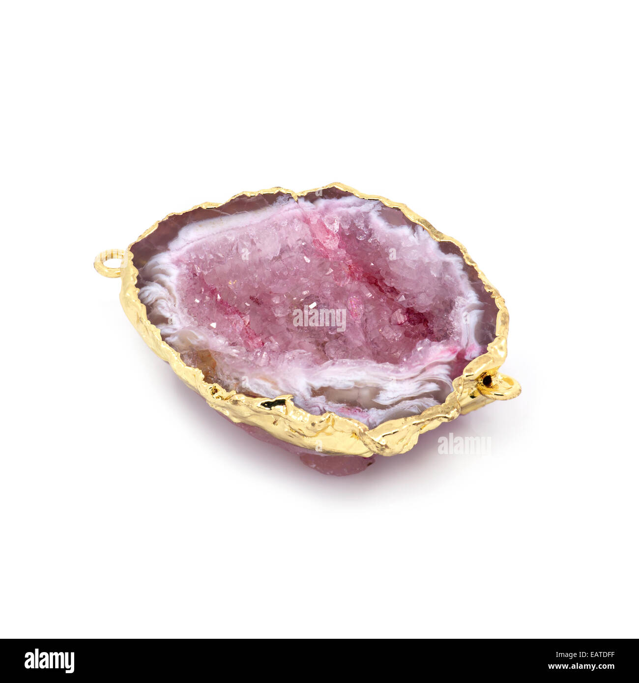 Beautiful natural pink mineral in gold frame. White background. Macro shooting. Stock Photo