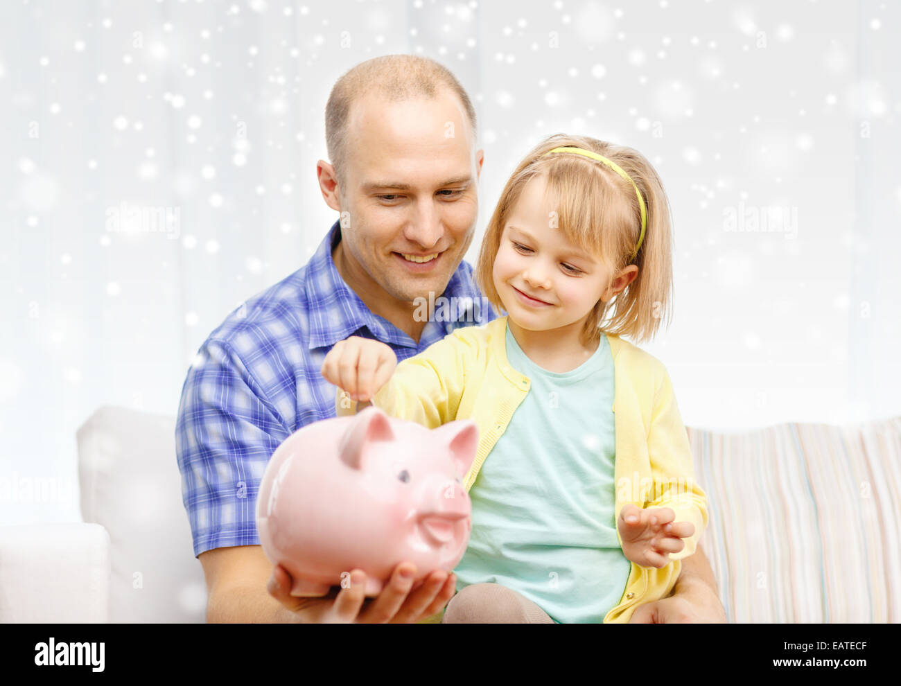 happy father and daughter with big piggy bank Stock Photo - Alamy