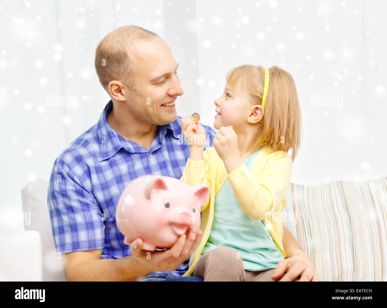 happy father and daughter with big piggy bank Stock Photo - Alamy