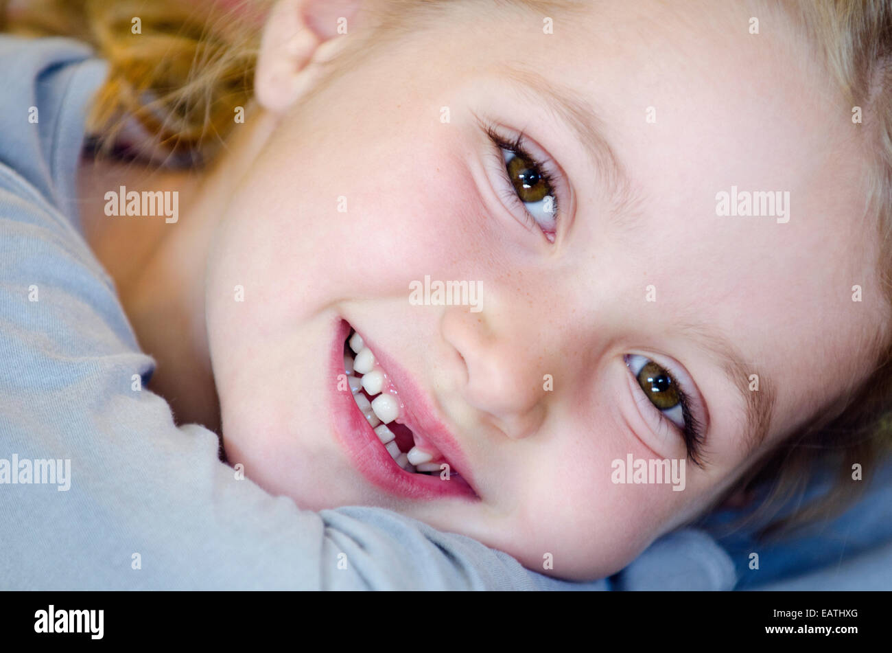 Portrait of a seven-year old girl after losing her first front tooth. Stock Photo