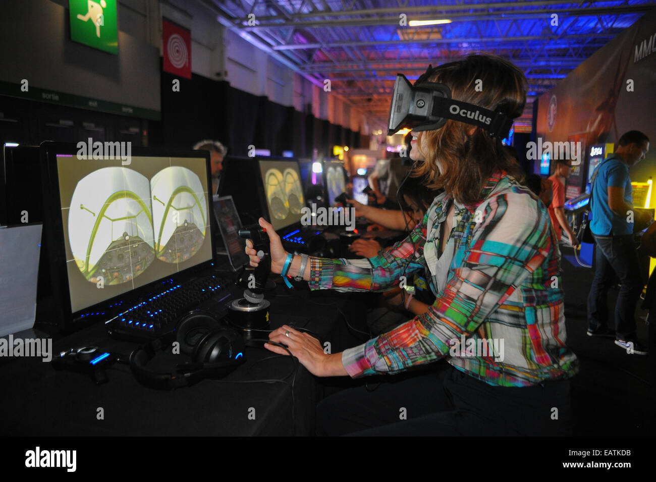August 13, 2014 - Paris, France:  A video game player tries the Oculus Rift, a 3D virtual reality headset. The computer screen d Stock Photo