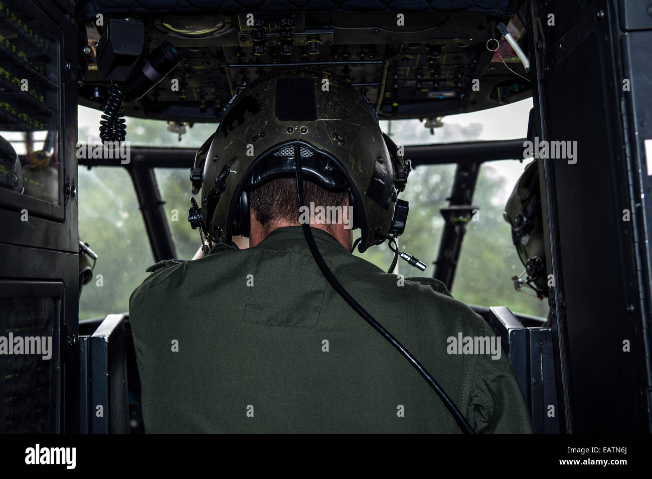 An airforce winch operator in an Atlas Oryx helicopter taking-off. Stock Photo