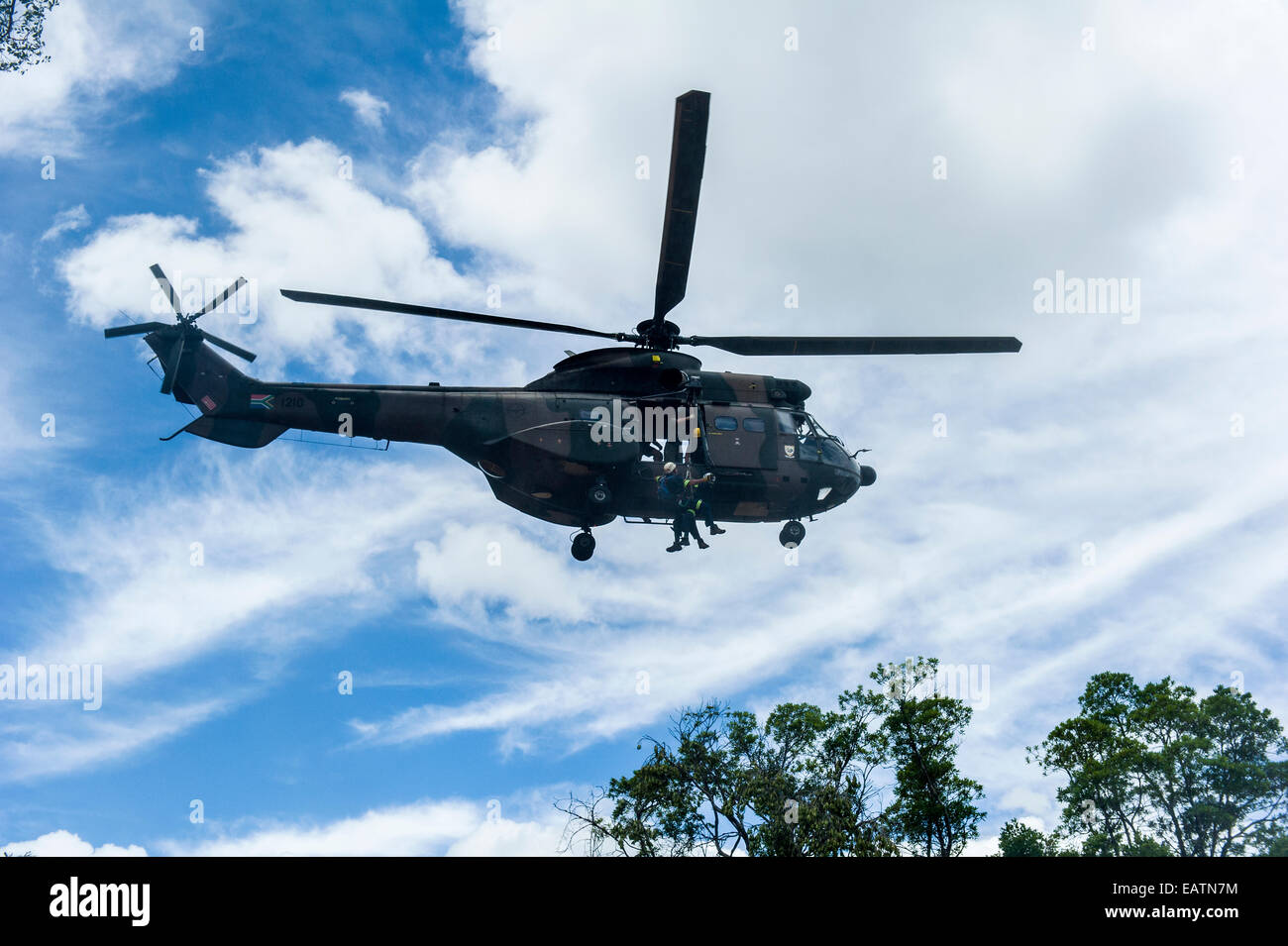 Airforce and police rescue crew lowered from an Atlas Oryx helicopter. Stock Photo