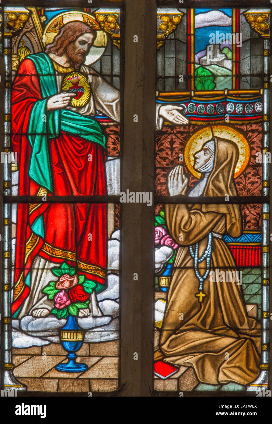 Trnava - The Heart of Jesus appearing to Saint Margaret Mary Alacoque on windowpane in St. Nicholas church Stock Photo