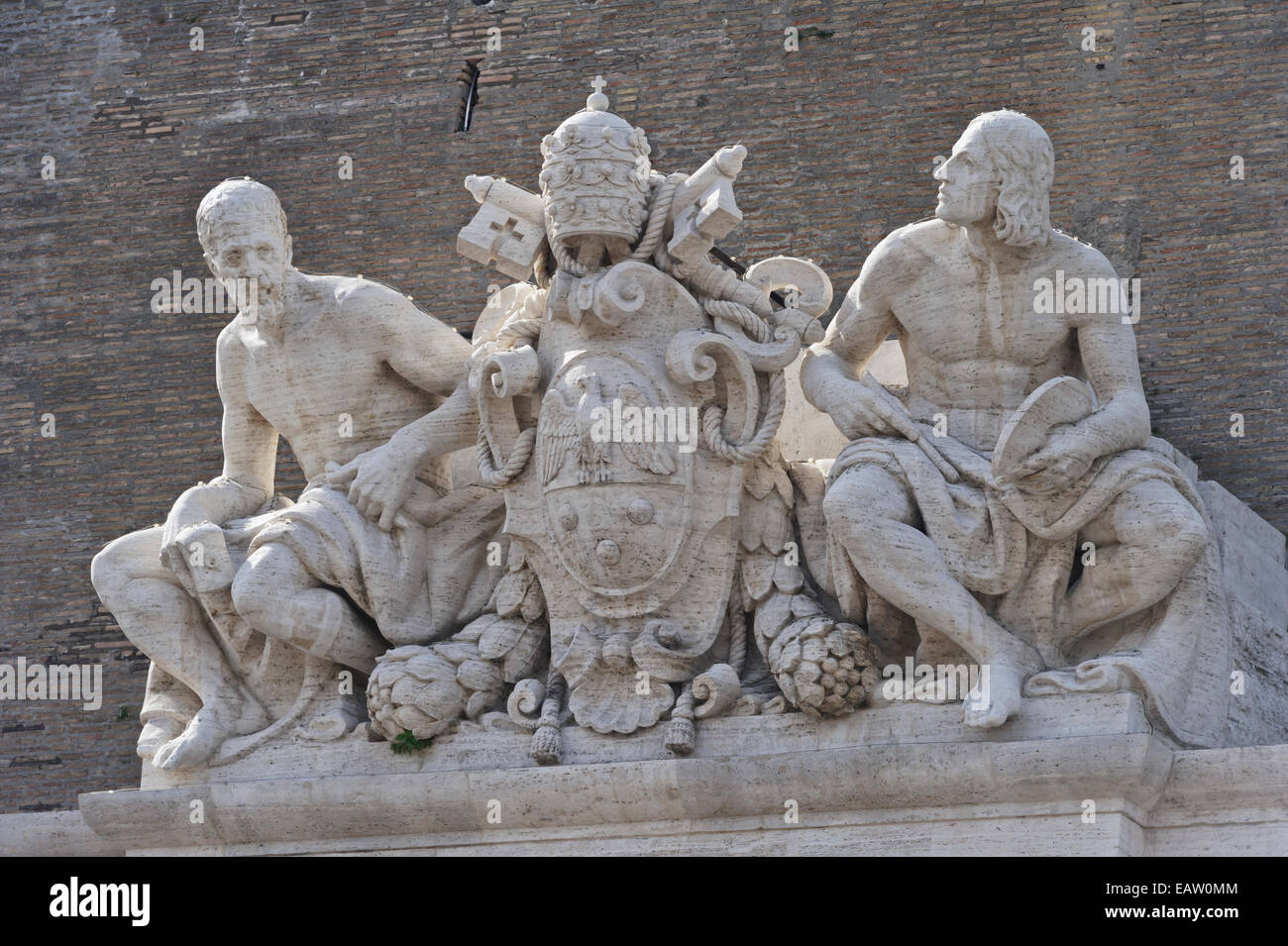 Statues of Michelangelo and Raphael over the Vatican museums
