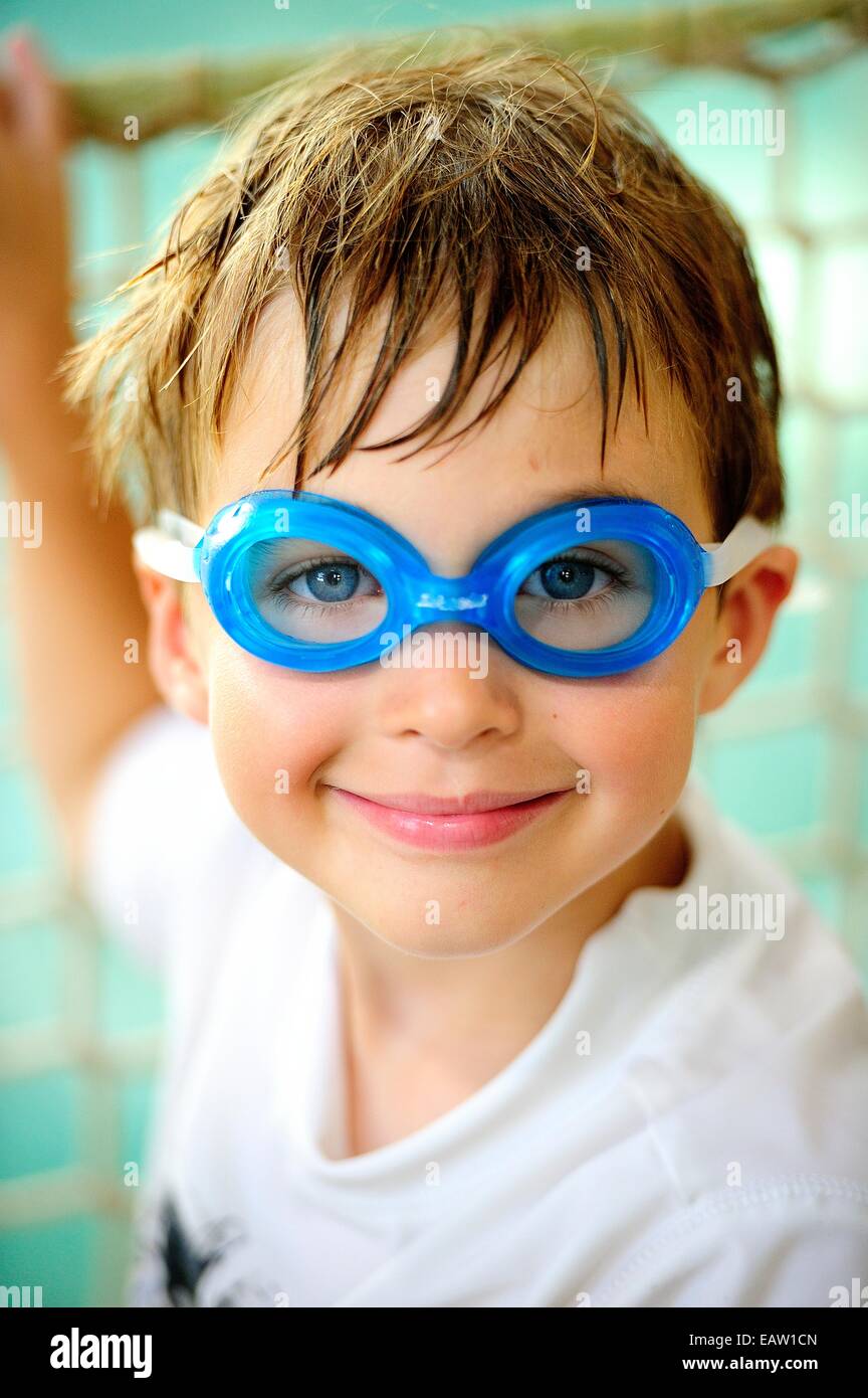 A boy with goggles on at the pool Stock Photo Alamy