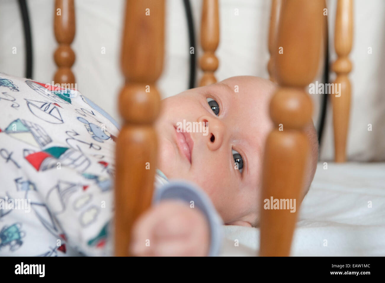 Baby in cot Stock Photo Alamy